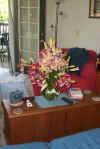 Lilies on coffee table.jpg (82001 bytes)